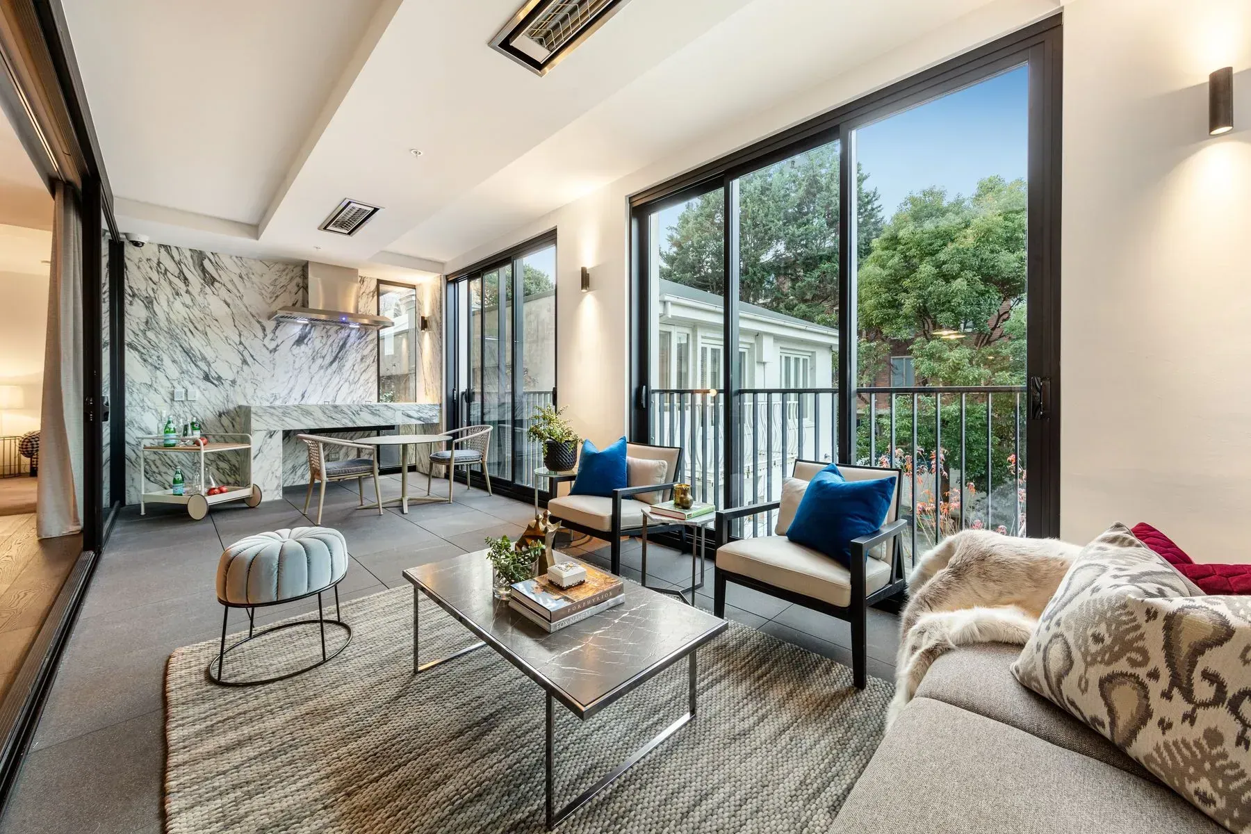 The Lyall Residences — living room with marble fireplace