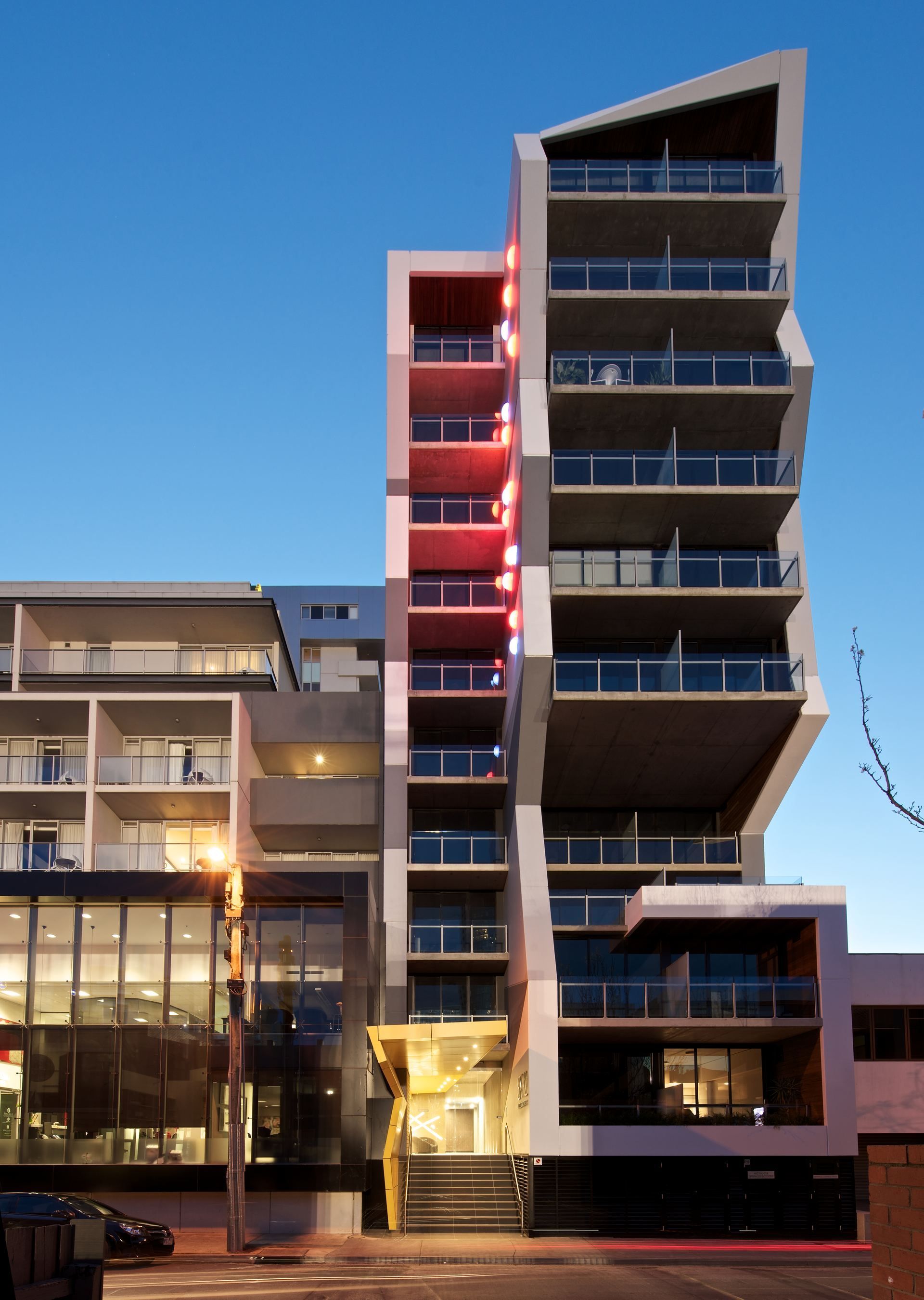 SXY2, South Yarra — street entry and tower at dusk